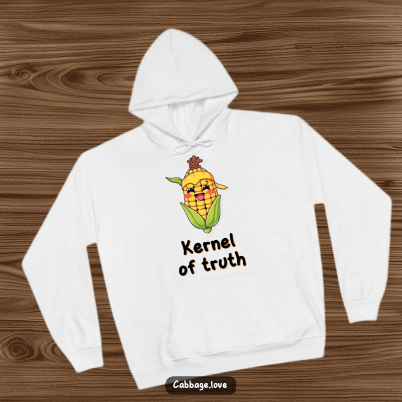 Funny hoodie depicting a happy corn cob with a yellow bandana, grinning wide, offering warmth and humorous veggie vibes.
